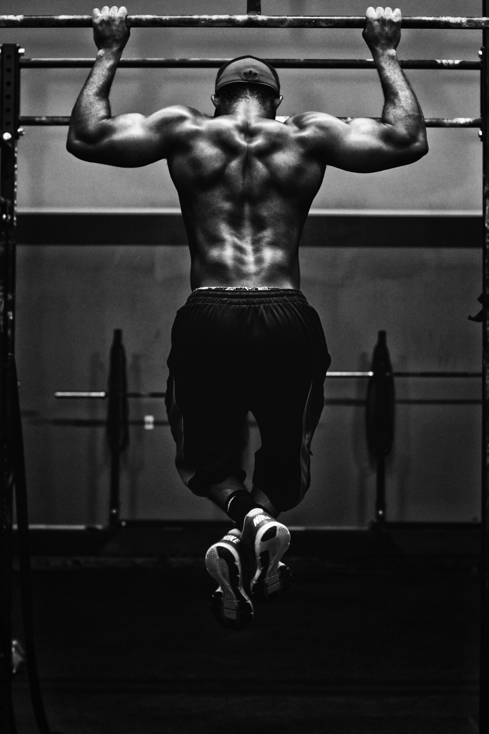 grayscale photo of man grayscale photo of man working out
