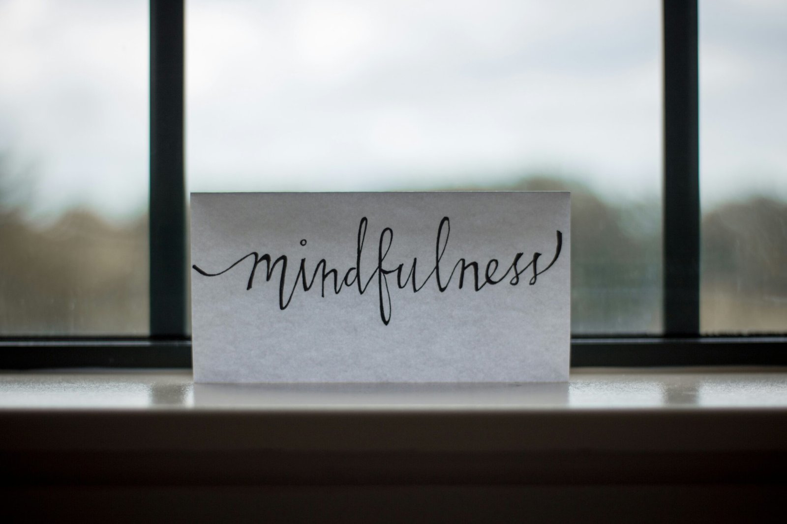 mindfulness printed paper near mindfulness printed paper near window